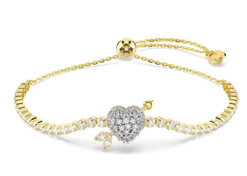 Brazalete Swarovski corazón y flecha pavé dorado
