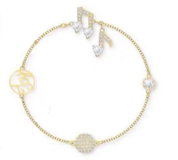 Brazalete Swarovski notas musicales cristal pavé tono dorado