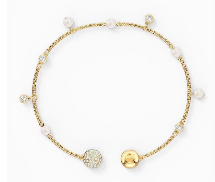 Brazalete Swarovski perlas y esferas pavé tono dorado