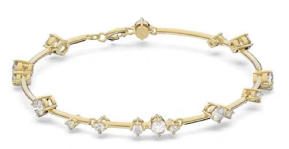 Brazalete Swarovski cristales dispersos tono dorado