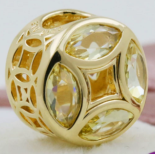Charm Pandora piedras marquesa amarillas baño dorado